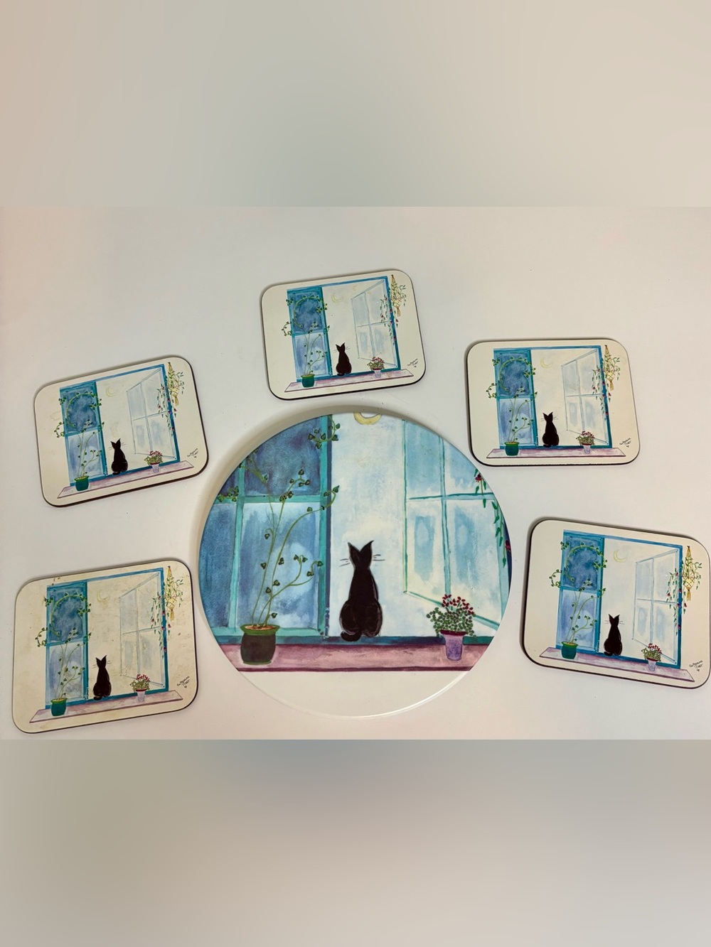Cat trivet and coasters by artist Catherine Piret Set in Blue, White & Black